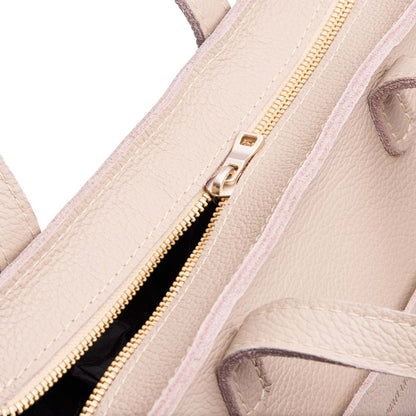 Oatmilk*Zipper | Close-up of zipper on midsize crossbody tote with handles and a pocket